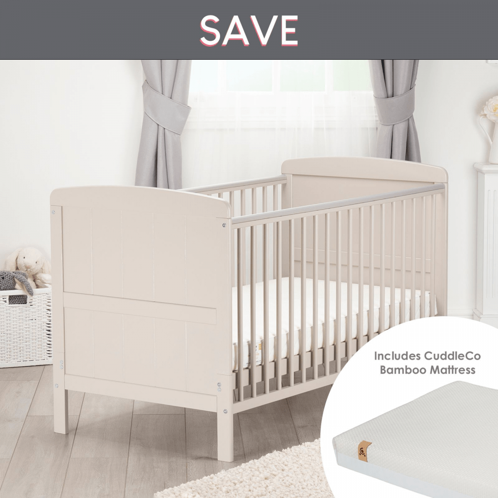grey cot with mattress
