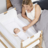 Mother interacting with baby in SnuzPod 4 Bedside Crib - Natural