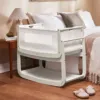 SnuzPod 4 Bedside Crib next to the bed with breathable mesh – Barley