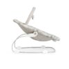 Side view of beige baby bouncer with alphabet pattern and curved metal rocking frame.