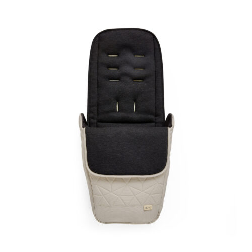 A close-up front view of the "Latte" footmuff, designed to complement the Silver Cross Clic 2 Stroller. The footmuff has a quilted lower section, a soft padded upper section, and multiple slots for harness adjustment.