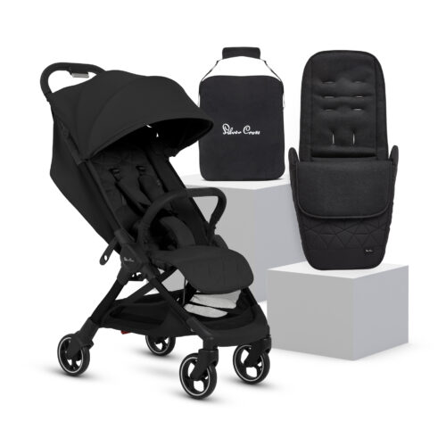 A sleek all-black Silver Cross Clic 2 Stroller displayed alongside a matching footmuff and a travel bag with the "Silver Cross" logo. The stroller features a quilted seat, adjustable canopy, and a five-point harness. The footmuff, designed for added warmth and comfort, is showcased on a white pedestal.
