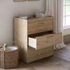 Silver cross Geneva Dresser in a well decorated nursery room with middle drawer open.