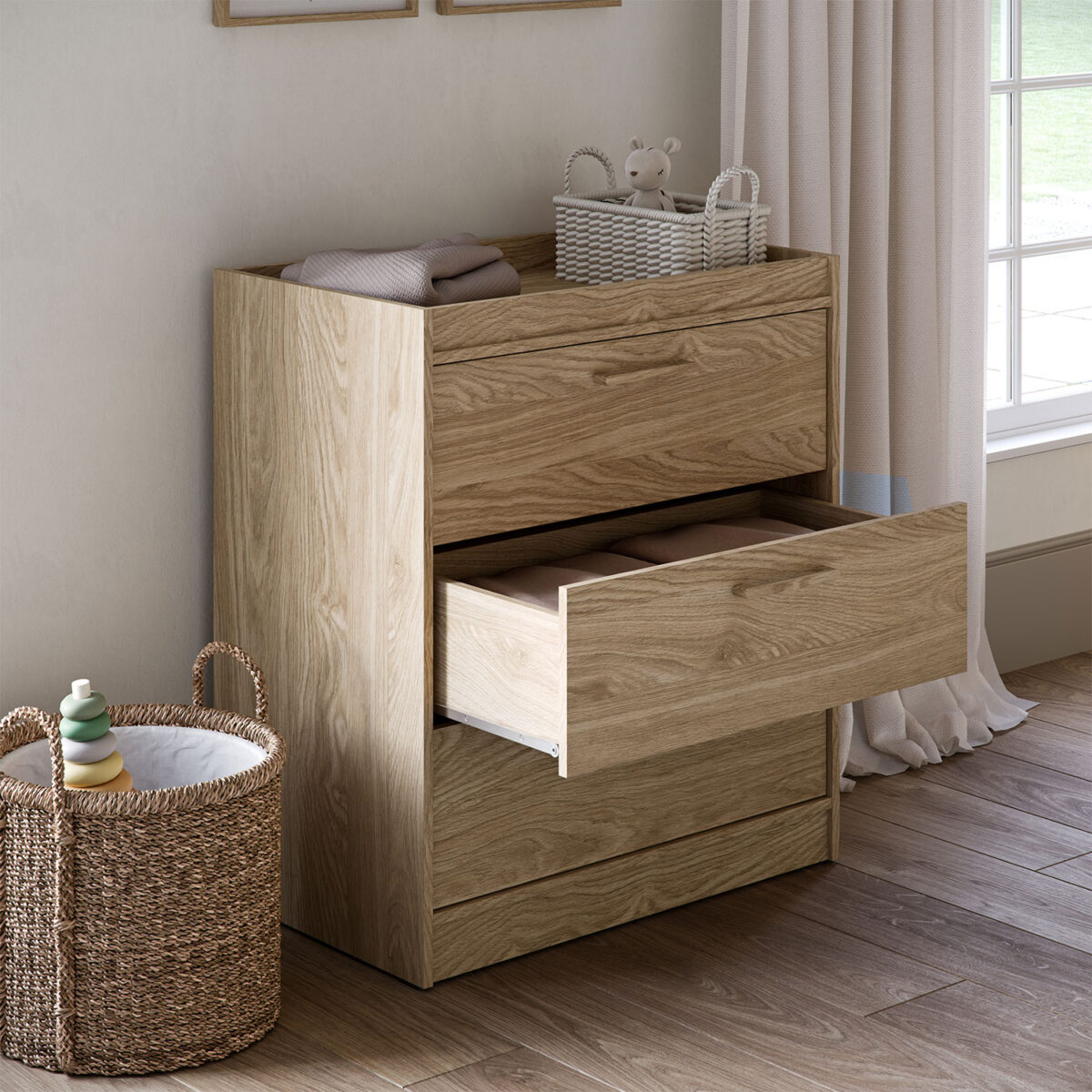 Silver cross Geneva Dresser in a well decorated nursery room with middle drawer open.