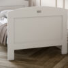 Nursery room featuring a Silver Cross Valencia Cot Bed in White & Natural Ash configured as a toddler bed from a close up front view