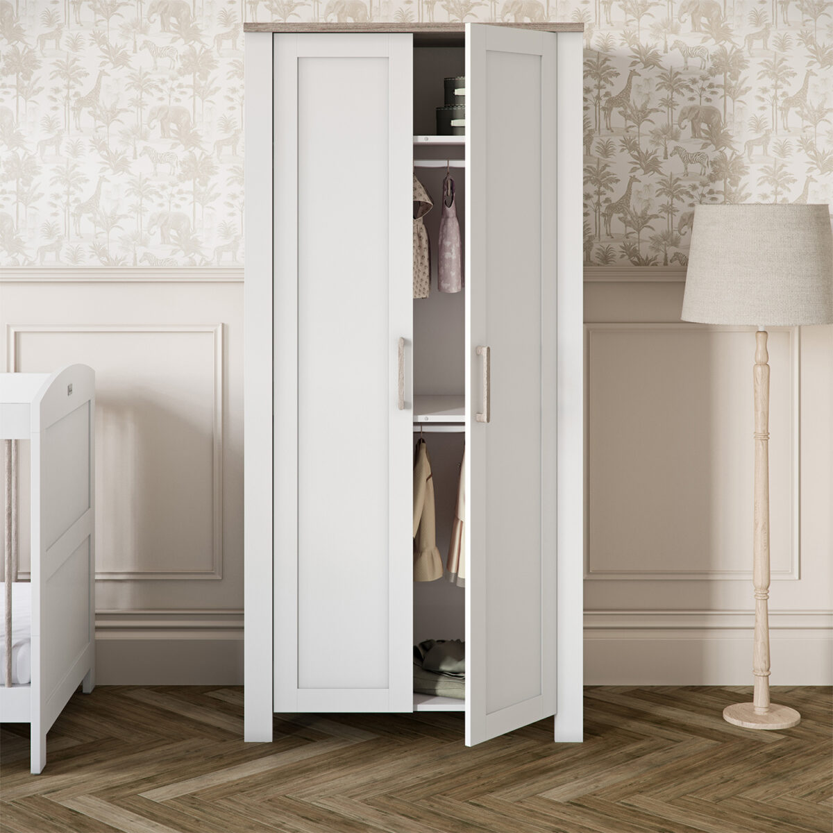 Nursery room featuring the Silver Cross Valencia Wardrobe in White & Natural Ash with with one of the doors open.