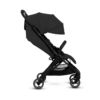 A side view of the black stroller, showing its extended canopy, reclined seating position, and sturdy black frame. The four swivel wheels highlight its lightweight and maneuverable design.