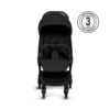 A front-facing view of the stroller with its black fabric, handlebar, and five-point harness system. A 