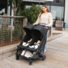 Uppababy-Minu-Duo-Twin-Pushchair-Jake-Black-Lifestyle-004-Sleeping-Newborn-Twins-in-Fully-Reclined-Seat-Position