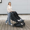 Uppababy-Minu-Duo-Twin-Pushchair-Jake-Black-Lifestyle-005-Sleeping-Twins-in-Fully-Reclined-Seat-Position
