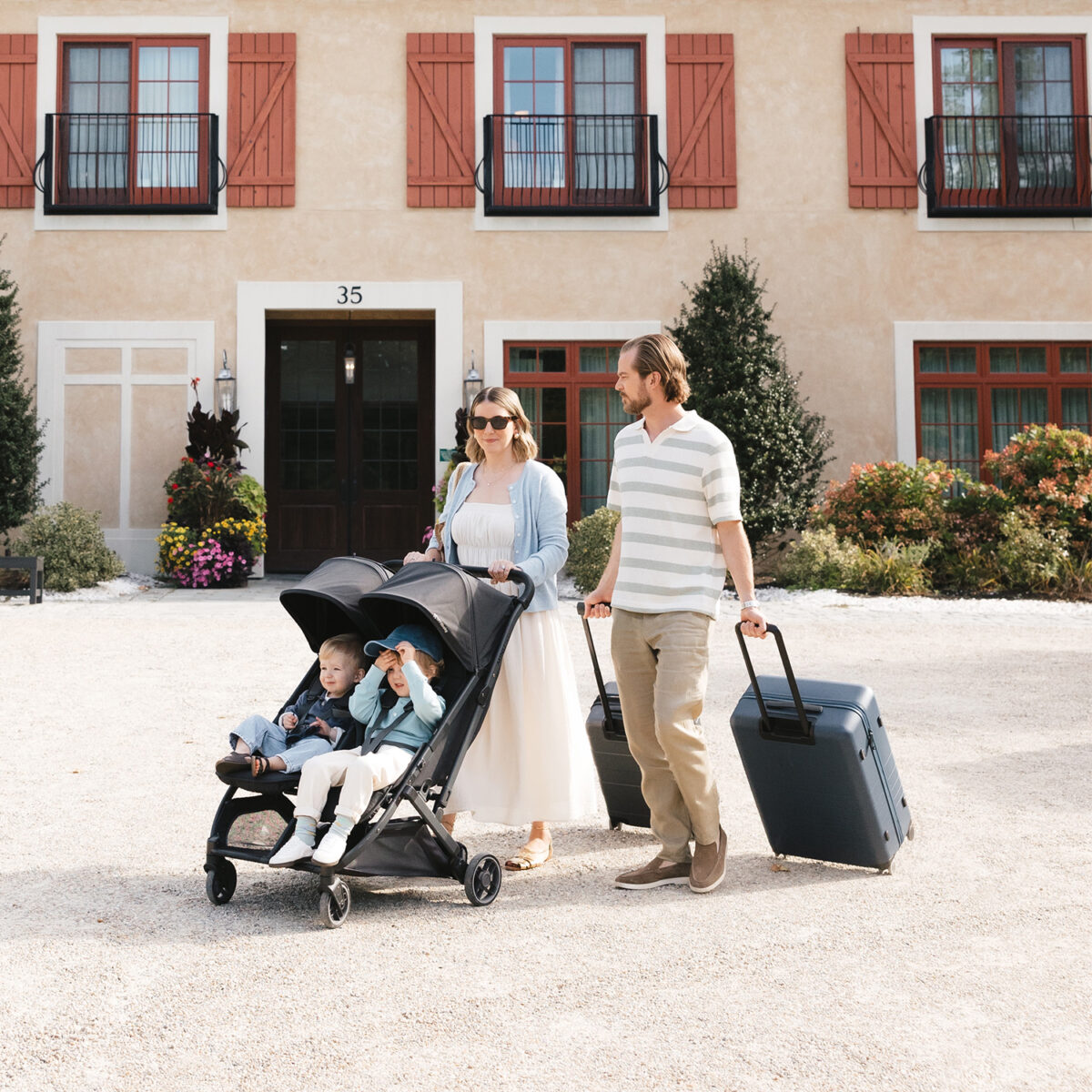 Uppababy-Minu-Duo-Twin-Pushchair-Jake-Black-Lifestyle-009-Two-Children-Upright-Seats-Extended-Hoods-Abroad-Summer-Holiday-Travel