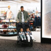 Uppababy-Minu-Duo-Twin-Pushchair-Jake-Black-Lifestyle-011-Seats-Fully-Upright-Travelling-Through-Airport