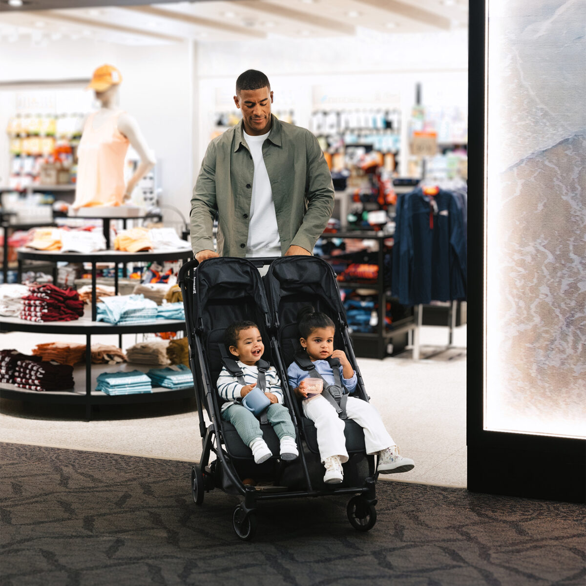 Uppababy-Minu-Duo-Twin-Pushchair-Jake-Black-Lifestyle-011-Seats-Fully-Upright-Travelling-Through-Airport