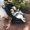 Uppababy-Minu-Duo-Twin-Pushchair-Jake-Black-Lifestyle-015-with-Bumper-Bar