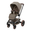 Maxi-Cosi Fame stroller in Twillic Truffle with padded seat, large canopy, and brown leatherette handle.
