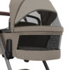 Maxi-Cosi carrycot in Twillic Truffle with breathable mesh ventilation window for airflow.