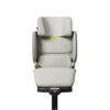Compact beige Axkid Up booster seat with padded comfort and adjustable headrest feature.