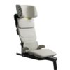 Axkid Up booster seat in beige reclined for comfort, with premium padding and safety labels.