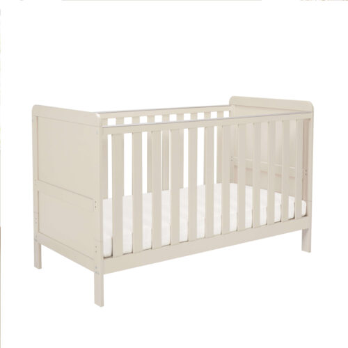 Angled side view of cashmere cot bed with clean lines and slatted rails.