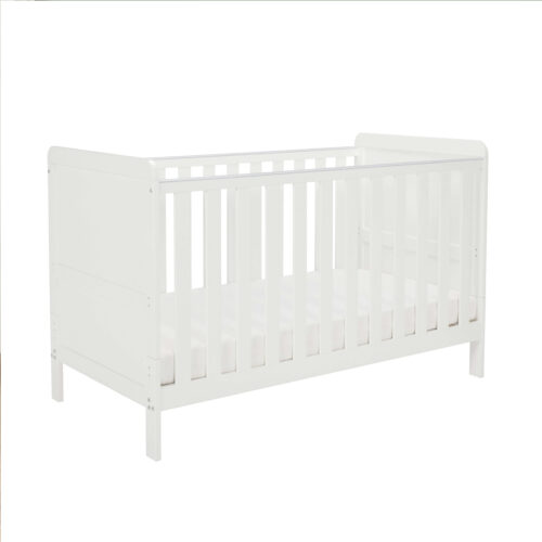 Side angle of white cot bed with slatted design and clean modern lines.