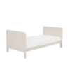 Cashmere toddler bed with side and end panels, shown from corner angle.