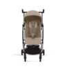 Side view of Cybex Libelle Compact Stroller in Almond Beige with extended canopy and reclined seat position.