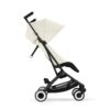 Side view of Cybex Libelle Compact Stroller in Canvas White with extended canopy and reclined seat position.