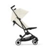 Cybex Libelle Canvas White stroller showing recline adjustment with lightweight frame and sun canopy.