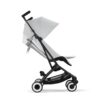 Side profile of Cybex Libelle stroller in Fog Grey in upright position with smooth wheels and mesh basket.