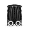 Folded Cybex Libelle Compact Stroller in Magic Black showing ultra-compact travel-friendly design.
