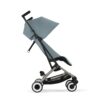 Side view of Cybex Libelle Compact Stroller in Stormy Blue with extended canopy and reclined seating.