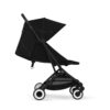 Side view of Cybex Orfeo stroller in Magic Black with a compact design and mesh storage basket.