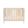 Studio view of Babymore Dante Mini Cot Bed in cot setup featuring a neutral cashmere finish.