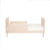Babymore Dante Mini Cot Bed in toddler mode featuring sleek build and full panel sides.