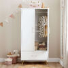 Wardrobe with one door open, showing baby clothes and blankets neatly arranged inside.