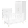 White crib, dresser, and wardrobe with gold legs shown on a plain white background.