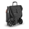 Greyson UPPAbaby MINU V3 stroller folded with carry handle on top for easy transport.