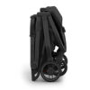Side view of the folded UPPAbaby MINU V3 stroller in Jake, showing compact design and wheels.