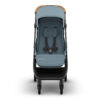 Front view of the UPPAbaby MINU V3 stroller in Dillan with harness and footrest visible.