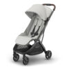 Angled front view of UPPAbaby MINU V3 stroller in Savannah with canopy partially extended.