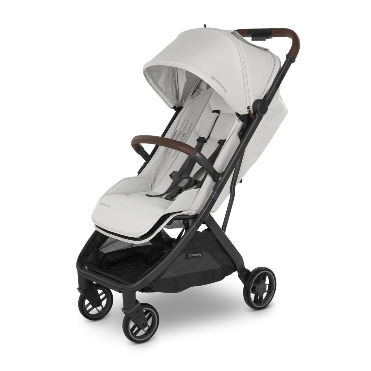 Angled view of white UPPAbaby stroller featuring dark brown leather accents and padded seating.