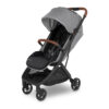 Angled view of grey UPPAbaby stroller with brown leather accents and padded black seat.
