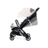 Stroller shown with canopy and seat in multiple adjustable positions in latte.